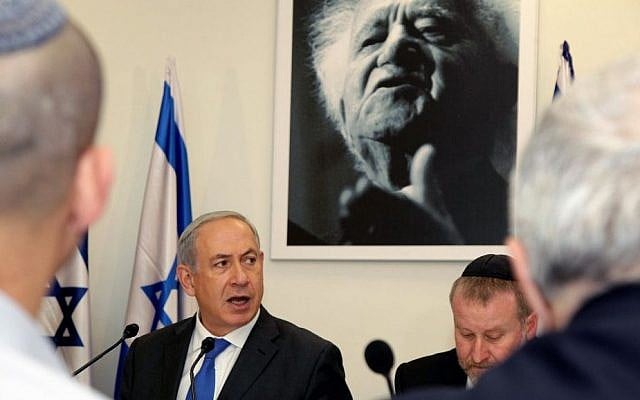 Prime Minister Benjamin Netanyahu sits under a portrait of the first Israeli prime minister David Ben-Gurion as he speaks during a special cabinet meeting at the Sde Boker academy to mark 40 years since Ben-Gurion's death. November 10, 2013. (Edi Israel/Pool/Flash90) Prime Minister Benjamin Netanyahu sits under a portrait of the first Israeli prime minister David Ben-Gurion as he speaks during a special cabinet meeting at the Sde Boker academy to mark 40 years since Ben-Gurion's death. November 10, 2013. (Edi Israel/Pool/Flash90)