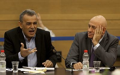 Arab-Israeli MKs Jamal Zahalka (L) and Basel Ghattas (R) seen at an Internal Affairs and Enviornment committee meeting in the Knesset, during a discussion regarding a bill regulating the Bedouin settlements. November 13, 2013. (photo credit: Flash 90) Arab-Israeli MKs Jamal Zahalka (L) and Basel Ghattas (R) seen at an Internal Affairs and Enviornment committee meeting in the Knesset, during a discussion regarding a bill regulating the Bedouin settlements. November 13, 2013. (photo credit: Flash 90)