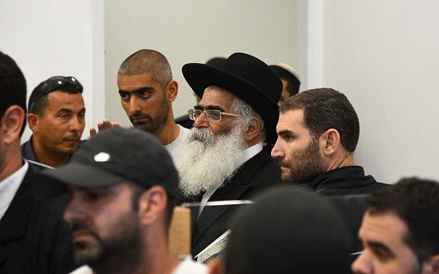 Rabbi Yoram Abergel, center, seen at the Lod District Court during a court hearing on November 14, 2013. (photo credit: Flash90) Rabbi Yoram Abergel, center, seen at the Lod District Court during a court hearing on November 14, 2013. (photo credit: Flash90)