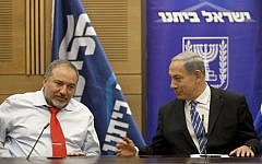 Prime Minister Benjamin Netanyahu and Foreign Minister Avigdor Liberman seen during a meeting of the Likud-Yisrael Beytenu faction in the Knesset on November 18, 2013. (Photo credit: Flash90)