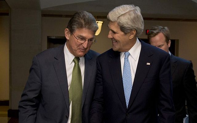 US Secretary of State John Kerry walks with Senate Banking Committee member Democratic Sen. Joe Manchin to a meeting with the committee in Washington, DC, on November 14, 2013. (Carolyn Kaster/AP) US Secretary of State John Kerry walks with Senate Banking Committee member Democratic Sen. Joe Manchin to a meeting with the committee in Washington, DC, on November 14, 2013. (Carolyn Kaster/AP)
