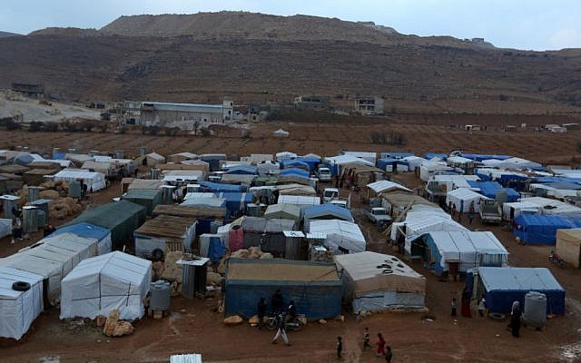 A Syrian refugee camp in the eastern Lebanese border town of Arsal in 2013. (photo credit: AP/Bilal Hussein/FIle) A Syrian refugee camp in the eastern Lebanese border town of Arsal in 2013. (photo credit: AP/Bilal Hussein/FIle)