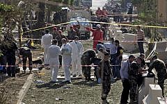 Lebanese Army investigators inspect the scene of two explosions, which killed 23 people, near the Iranian Embassy in Beirut, Lebanon, Tuesday (photo credit: AP/Bilal Hussein)