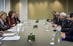 EU foreign policy chief Catherine Ashton, second left, and Iranian Foreign Minister Mohammad Javad Zarif, third right, are pictured during talks last year over Iran's nuclear program in Geneva, Switzerland (photo credit: AP/Fabrice Coffrini)