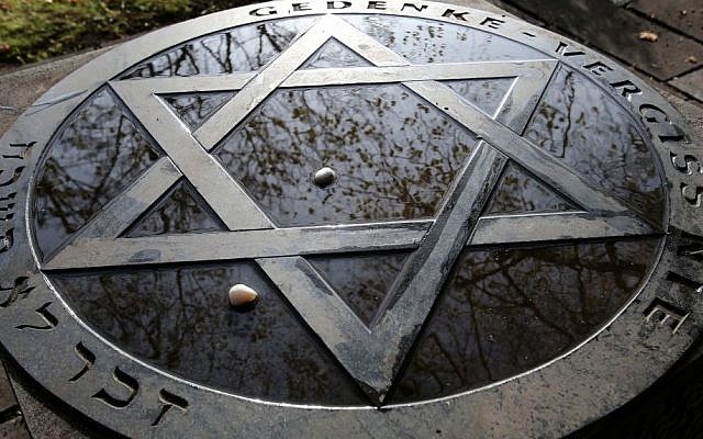 A memorial at the Jewish cemetery in Rostock in eastern Germany reads: 'Remember - Never Forget', Saturday Nov. 9, 2013. (Photo credit: AP/dpa,Bernd Wuestneck) A memorial at the Jewish cemetery in Rostock in eastern Germany reads: 'Remember - Never Forget', Saturday Nov. 9, 2013. (Photo credit: AP/dpa,Bernd Wuestneck)