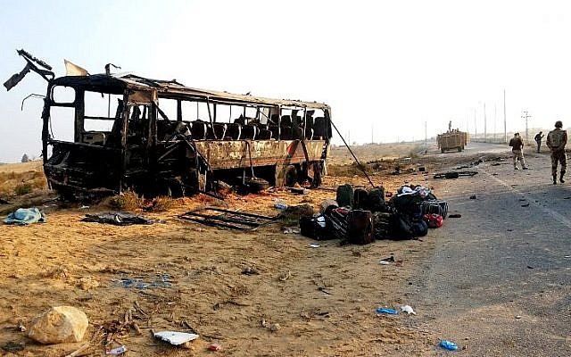 Egyptian military soldiers inspect the scene after a suicide attacker drove his explosive-laden car into the bus near the border town of Rafah, November 20, 2013. (AP/Official Facebook Page of the Egyptian Military Spokesman of the Armed Forces) Egyptian military soldiers inspect the scene after a suicide attacker drove his explosive-laden car into the bus near the border town of Rafah, November 20, 2013. (AP/Official Facebook Page of the Egyptian Military Spokesman of the Armed Forces)