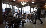 Illustrative: Diners sit in the Abu Ghosh Restaurant, on the outskirts of Jerusalem, November 20, 2013. (AP/Sebastian Scheiner)