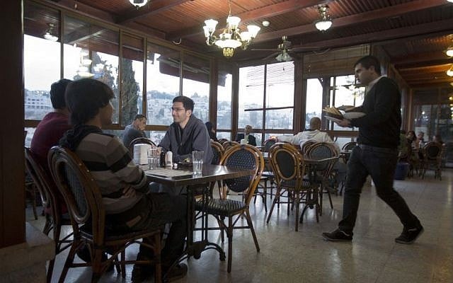 Illustrative: Diners sit in the Abu Ghosh Restaurant, on the outskirts of Jerusalem, November 20, 2013. (AP/Sebastian Scheiner) Illustrative: Diners sit in the Abu Ghosh Restaurant, on the outskirts of Jerusalem, November 20, 2013. (AP/Sebastian Scheiner)