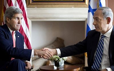 US Secretary of State John Kerry, left, shakes hands with Prime Minister Benjamin Netanyahu in Jerusalem, Wednesday, November 6, 2013 (photo credit: AP/Jason Reed, Pool)