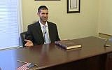 New Haven, Connecticut Rabbi Noah Muroff discovered $98,000 in cash in a desk he bought on Craigslist, November 10, 2013. (Screenshot from News8 TV report)