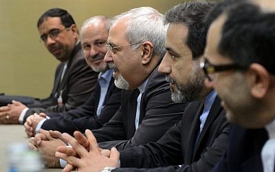 Iranian Foreign Minister Mohammad Javad Zarif, center, attends talks in Geneva on Iran's nuclear program, November 22, 2013. (photo credit: AP/Fabrice Coffrini)