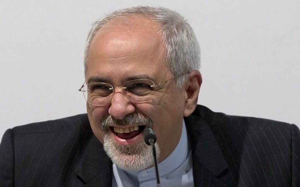 Iranian Foreign Minister Mohammad Javad Zarif smiles and laughs as he speaks to the media at the International Conference Centre of Geneva, Sunday, Nov. 24, 2013, after the interim deal was concluded. (photo credit: AP Photo/Carolyn Kaster, Pool) Iranian Foreign Minister Mohammad Javad Zarif smiles and laughs as he speaks to the media at the International Conference Centre of Geneva, Sunday, Nov. 24, 2013, after the interim deal was concluded. (photo credit: AP Photo/Carolyn Kaster, Pool)