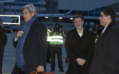 US Secretary of State John Kerry arrives at Geneva International airport, Saturday, Nov. 23, 2013, in Geneva, Switzerland, for the Iran nuclear talks. (photo credit: AP Photo/Carolyn Kaster, Pool)