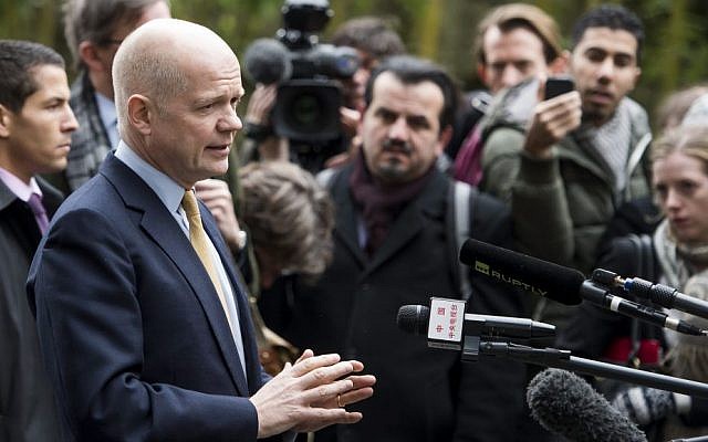 British Foreign Secretary William Hague speaks to journalists as he arrives at the Intercontinental Hotel prior to talks on Iran's nuclear program in Geneva, Switzerland, Saturday, Nov. 23, 2013. (photo credit: AP Photo/Keystone,Jean-Christophe Bott)