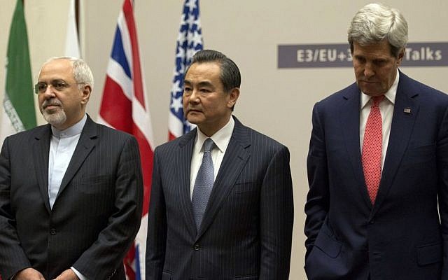Iranian Foreign Minister Mohammad Javad Zarif, left, Chinese Foreign Minister Wang Yi, center, and US Secretary of State John Kerry attend a ceremony after an agreement was reached on Iran's nuclear program at the United Nations in Geneva, Switzerland, Nov. 24, 2013. (photo credit: AP/Keystone/Martial Trezzini) Iranian Foreign Minister Mohammad Javad Zarif, left, Chinese Foreign Minister Wang Yi, center, and US Secretary of State John Kerry attend a ceremony after an agreement was reached on Iran's nuclear program at the United Nations in Geneva, Switzerland, Nov. 24, 2013. (photo credit: AP/Keystone/Martial Trezzini)