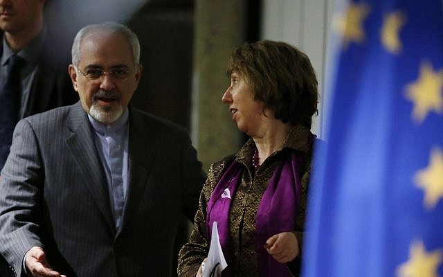 Iranian Foreign Minister Mohammad Javad Zarif, left, gestures to Catherine Ashton, the European Union's foreign policy chief, as they arrive at a press conference at the end of the Iranian nuclear talks in Geneva, Sunday, November 10, 2013 (photo credit: AP/Jason Reed, Pool) Iranian Foreign Minister Mohammad Javad Zarif, left, gestures to Catherine Ashton, the European Union's foreign policy chief, as they arrive at a press conference at the end of the Iranian nuclear talks in Geneva, Sunday, November 10, 2013 (photo credit: AP/Jason Reed, Pool)