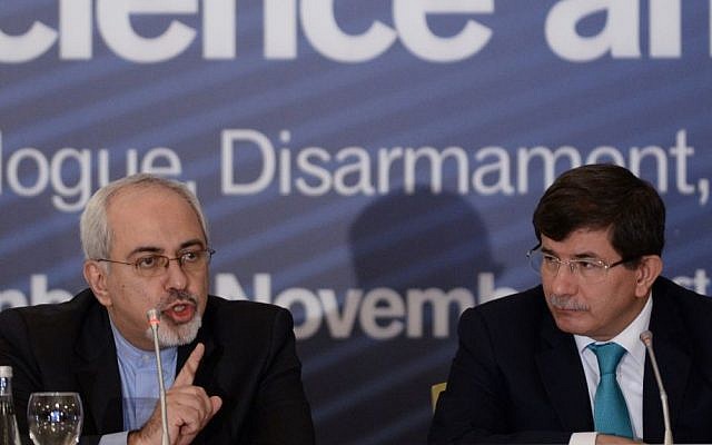 Turkish Foreign Minister Ahmet Davutoglu, right, with his Iranian counterpart, Mohammad Javad Zarif, in Istanbul, Turkey, earlier this month (photo credit: AP) Turkish Foreign Minister Ahmet Davutoglu, right, with his Iranian counterpart, Mohammad Javad Zarif, in Istanbul, Turkey, earlier this month (photo credit: AP)