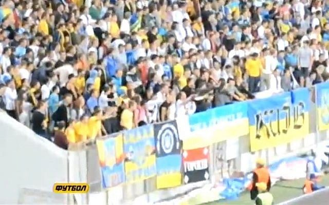 Ukrainian soccer fans doing a Nazi salute against their own team member. (Screen capture: YouTube)
