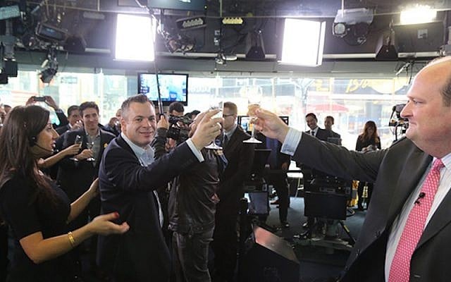 The Wix team toasts its IPO on the Nasdaq trading floor, November 2013. (Photo credit: Courtesy Wix) The Wix team toasts its IPO on the Nasdaq trading floor, November 2013. (Photo credit: Courtesy Wix)