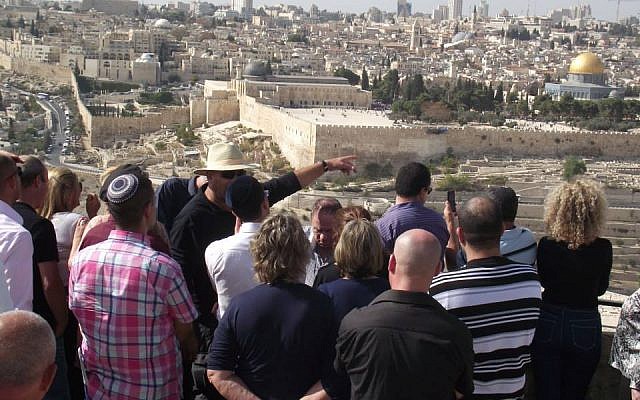 Shaul Arieli, looking at the holy basin of Jerusalem from the Mount of Olives, with Likud Central Committee members (Photo credit: Courtesy Shaul Arieli/ Facebook)
