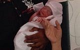 The first baby born in the IDF field hospital in the Philippines was named 'Israel,' Friday, November 15, 2013. (photo credit: IDF Rescue/Twitter)