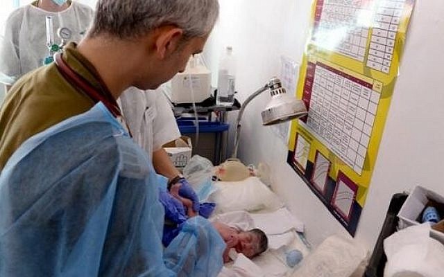 Members of the IDF mission to the Philippines deliver their first baby boy in the field hospital they set up in the country. The baby was named 'Israel' by his parents. (IDF Rescue/Twitter) Members of the IDF mission to the Philippines deliver their first baby boy in the field hospital they set up in the country. The baby was named 'Israel' by his parents. (IDF Rescue/Twitter)