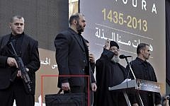 Hassan Nasrallah and his security detail at a recent appearance in Beirut (Photo credit: AP/Bilal Hussein)