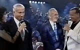 Benjamin Netanyahu and Shimon Peres, flanked by Ofra Haza and Dan Shilon, sing 'Ani V'Ata' on TV in 1995 (photo credit: YouTube screenshot)