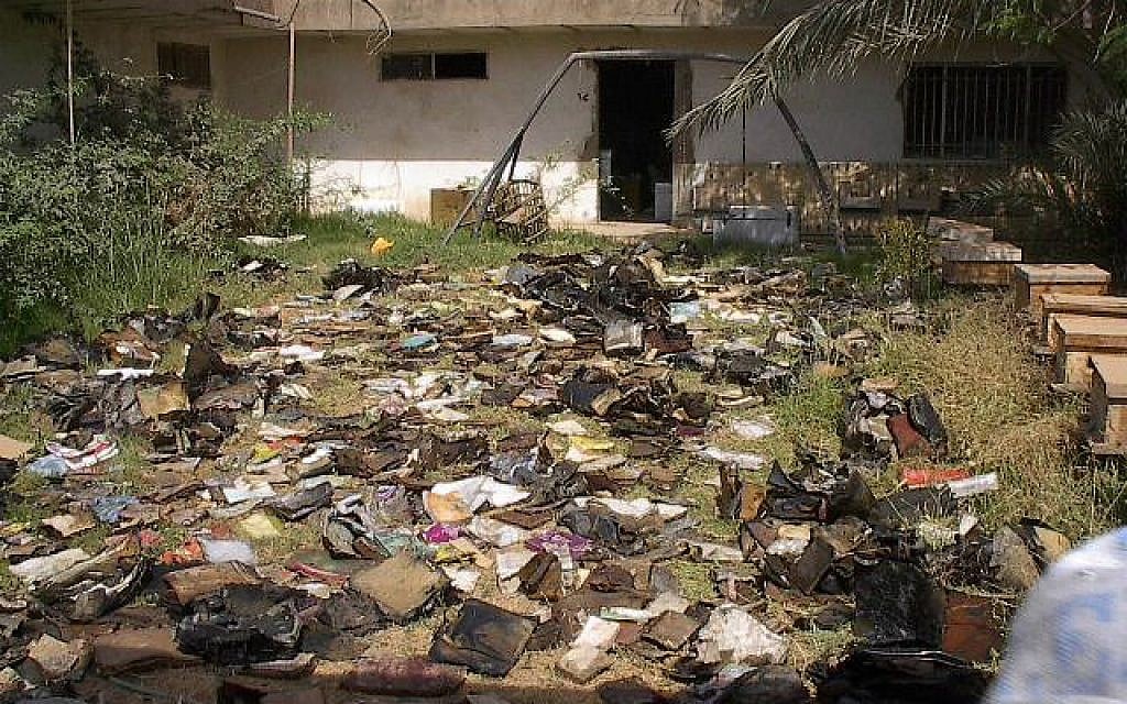 Thousands of waterlogged Jewish books and documents shortly after their discovery in a flooded basement of Saddam Hussein's former intelligence headquarters, May 2003. (Photo credit: courtesy The National Archives) Thousands of waterlogged Jewish books and documents shortly after their discovery in a flooded basement of Saddam Hussein's former intelligence headquarters, May 2003. (Photo credit: courtesy The National Archives)