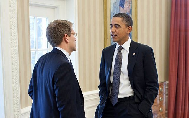 Jay Carney, left, speaking to Barack Obama. (photo credit: Pete Souza/White House)