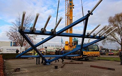 The Christians for Israel menorah being mounted in Nijkerk near Amsterdam on Nov. 25, 2013. (photo credit: Sara van Oordt, Christians for Israel/JTA)