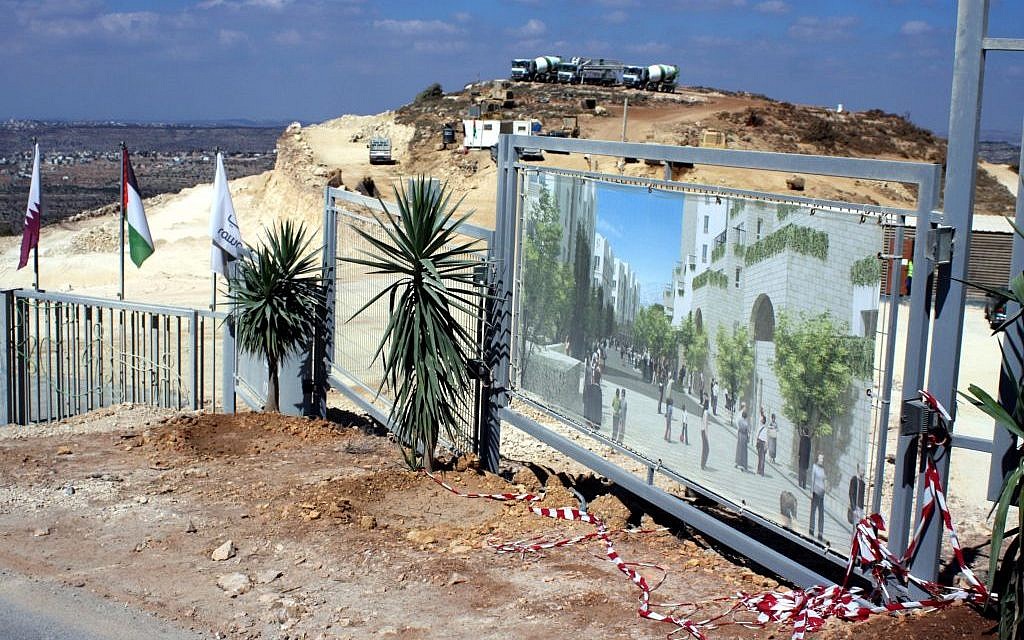 Palestinian bulldozers excavate a construction site in the first Palestinian planned city, Rawabi, October 2010 (photo credit: Issam Rimawi/Flash90) Palestinian bulldozers excavate a construction site in the first Palestinian planned city, Rawabi, October 2010 (photo credit: Issam Rimawi/Flash90)