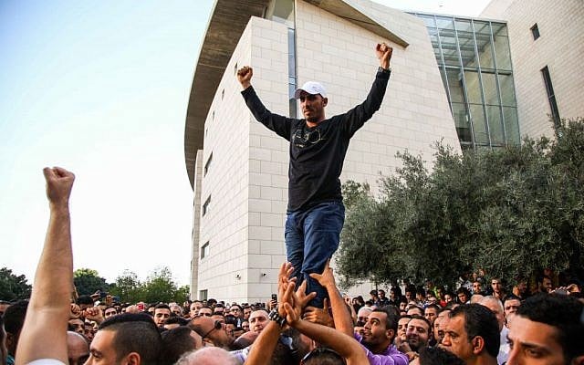 Arab Israelis protest outside the Haifa District Court during the sentencing of seven Israeli Arab men convicted of attempted manslaughter in the killing of Jewish terrorist Eden Natan Zada, Thursday, November 28, 2013 (photo credit: Avishag Shaar Yeshuv/Flash 90) Arab Israelis protest outside the Haifa District Court during the sentencing of seven Israeli Arab men convicted of attempted manslaughter in the killing of Jewish terrorist Eden Natan Zada, Thursday, November 28, 2013 (photo credit: Avishag Shaar Yeshuv/Flash 90)