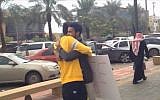 A man offering free hugs in Saudi Arabia. (Screenshot: YouTube)