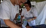 The Israeli delegation's medical team treat victims of Typhoon Haiyan in the Philippines, November 20, 2013. (IDF Spokesperson's Unit/Twitter)