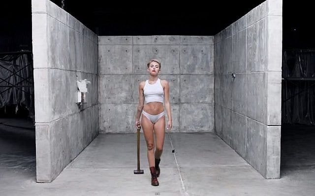 Miley Cyrus in a scene from the clip to her song 'Wrecking Ball' (screen capture: YouTube)