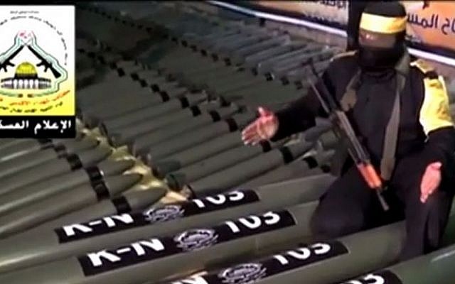 An al-Aqsa Martyrs' Brigade gunman shows off rockets in a video uploaded to the organization's Facebook and YouTube pages (screen capture: YouTube)