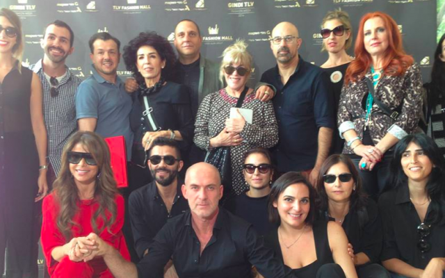 Celebrity singer Paula Abdul (bottom left) joined Gindi TLV Fashion Week producer Motty Reif (seated, center) and a group of the featured designers at the press conference announcing the March 2014 fashion week (Courtesy Sasson Kedem) Celebrity singer Paula Abdul (bottom left) joined Gindi TLV Fashion Week producer Motty Reif (seated, center) and a group of the featured designers at the press conference announcing the March 2014 fashion week (Courtesy Sasson Kedem)