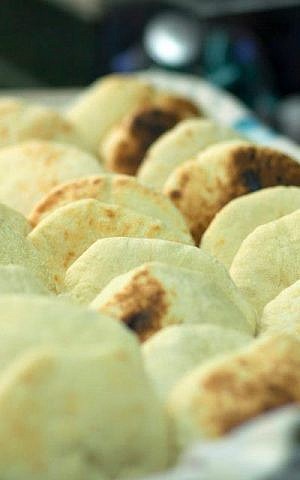 Freshly baked pita bread. (photo credit: Courtesy of Vered Maoz)