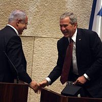 US president George W. Bush shake hands with Benjamin Netanyahu, head of the opposition, at the Knesset on May 15, 2008. Bush delivered a speech to mark the Jewish state's 60th birthday. (Photo credit: Lior Mizrahi/pool/FLASH90)