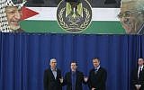 Israeli new Labor Party leader Isaac Herzog speaks during a press conference flanked by his party officials Erel Margalit, right, and Omer Bar-Lev after their meeting with Palestinian President Mahmoud Abbas in the West Bank city of Ramallah, Sunday, Dec. 1, 2013. (photo credit: AP /Majdi Mohammed)
