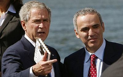 Former US president George W. Bush stands next to Russian dissident Garry Kasparov (photo credit: AP)