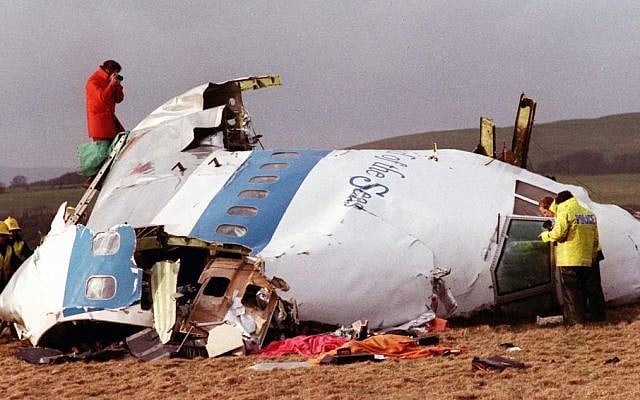 Police and investigators look at what remains of the flight deck of Pan Am 103 in a field in Lockerbie, Scotland, December 22, 1988. (photo credit: AP) Police and investigators look at what remains of the flight deck of Pan Am 103 in a field in Lockerbie, Scotland, December 22, 1988. (photo credit: AP)
