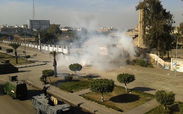 Egyptian security forces fire tear gas to disperse supporters of ousted president Mohammed Morsi as they protest at Al-Azhar University in Cairo, Egypt, Friday, Dec. 27, 2013. (Photo credit: AP/Mohamed Hassan) Egyptian security forces fire tear gas to disperse supporters of ousted president Mohammed Morsi as they protest at Al-Azhar University in Cairo, Egypt, Friday, Dec. 27, 2013. (Photo credit: AP/Mohamed Hassan)