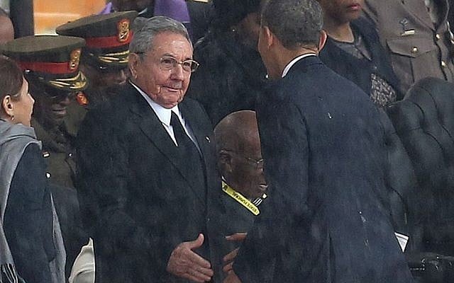 US President Barack Obama, right, shakes hands with Cuban President Raul Castro in South Africa on Tuesday December 10, 2013. (photo credit: AP) US President Barack Obama, right, shakes hands with Cuban President Raul Castro in South Africa on Tuesday December 10, 2013. (photo credit: AP)