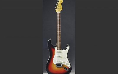 This undated photo provided by Christie's Auction House shows the Fender Stratocaster a young Bob Dylan played at the historic 1965 Newport Folk Festival. The festival was a defining moment that marked Dylan's move from acoustic folk to electric rock 'n' roll. The guitar was sold at auction on Friday, Dec. 6, 2013 for $965,000. (photo credit: AP/Christie's Auction House)
