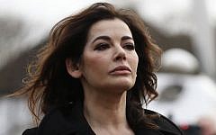 Celebrity chef, Nigella Lawson, arrives at Isleworth Crown Court in London, Thursday, Dec. 5, 2013. (photo credit: AP Photo/Sang Tan)