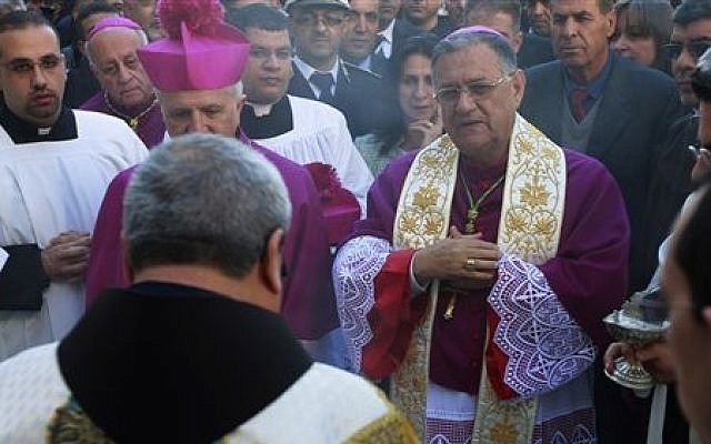 Latin Patriarch of Jerusalem Fouad Twal, center, arrives to the Church of the Nativity, traditionally believed by Christians to be the birthplace of Jesus Christ, in the West Bank town of Bethlehem, Tuesday, Dec. 24, 2013 (photo credit: AP/Majdi Mohammed) Latin Patriarch of Jerusalem Fouad Twal, center, arrives to the Church of the Nativity, traditionally believed by Christians to be the birthplace of Jesus Christ, in the West Bank town of Bethlehem, Tuesday, Dec. 24, 2013 (photo credit: AP/Majdi Mohammed)