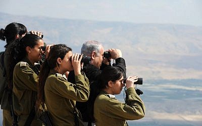 Prime Minister Netanyahu, who has demanded a permanent Israeli presence in the Jordan Valley, with IDF officers in the region in 2011 (photo credit: Moshe Milner/GPO/ Flash90)