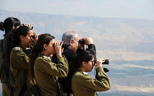 Prime Minister Netanyahu, who has demanded a permanent Israeli presence in the Jordan Valley, with IDF officers in the region in 2011 (photo credit: Moshe Milner/GPO/ Flash90)